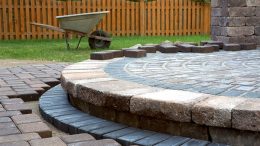 Adding a paved path or patio to your backyard can be a great way to create more usable space for your outdoor activities. Laying pavers is not as difficult as you might think, and with the right tools and materials, it’s a project that can be easily accomplished in just one weekend. Here we will look at a helpful few tips for laying pavers around your home or property. Planning and Preparation Determine the area where you want to lay the pavers and measure it accurately. You'll also need to calculate the number of pavers you'll need. Prepare the ground by removing any vegetation or debris and excavating to the appropriate depth. Base Preparation Create a solid base for the pavers by adding a layer of crushed rock or gravel to the excavated area. Compact the base material with a plate compactor to ensure a level surface. Sand Layer Add a layer of sand over the base material and use a screed board to level it out. The sand layer should be about an inch thick. Lay the Pavers Starting at a corner, begin laying the pavers in the desired pattern. There are several common paving patterns used in construction, including: • Running bond pattern - This is the most common and simplest paving pattern. It involves laying rectangular or square pavers in a staggered pattern, with each row offset by half the length of the paver. This creates a brick-like appearance that is often used for sidewalks, patios, and driveways. • Herringbone - This pattern is created by laying rectangular pavers in a 45-degree angle to create a zigzag pattern. It is often used for driveways, walkways, and patios because it provides excellent traction and stability. It’s also aesthetically pleasing. • Basket weave - This pattern is created by alternating sets of two rectangular pavers that are placed perpendicular to each other. It creates a simple, yet elegant look that is often used for small patios and walkways. • Circular - This pattern involves laying pavers in a circular shape, often with a centre focal point. It is a popular choice for garden paths, small patios, and outdoor seating areas. • Random pattern - This pattern involves using a mix of pavers in different shapes and sizes to create a random, natural-looking pattern. It is often used for larger patios and outdoor living spaces. If necessary, cut the pavers using a saw or chisel to fit them around the edges of the area or to make adjustments to the pattern. Use a rubber mallet to tap each paver into place, making sure they are level with each other. Check the level frequently to ensure an even surface. Fill the Joints Once all the pavers are in place, sweep sand over the surface to fill the joints. Use a plate compactor to vibrate the pavers and help settle the sand further into the joints. Seal the Surface Sealing isn’t essential however it will help to protect the surface and enhance its appearance. It’s important to remember that these are general steps and specific details may vary depending on the type of pavers and the particular project. Always follow manufacturer instructions and safety guidelines, if you aren’t confident to tackle the project yourself, seek advice from a local landscaper or garden supplies centre. Somerville Garden Supplies – Mornington Peninsular Locals Rely on Us If you want to spruce up your backyard with a new paved area, or you need help with crushed rock driveway maintenance, the team at Bittern Garden Supplies is here to help. We have been servicing the local area for over 25 years with high quality products and services at competitive prices. For crushed rock, sand, soil, or screenings, get in touch with us today by calling 5983 9779.